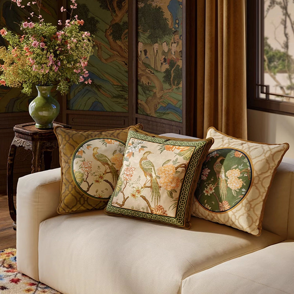 Aviary bird and floral pillow covers styled in a traditional living room