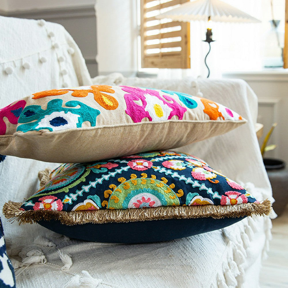 Side profile showing the thickness and embroidered texture of the colorful boho pillow cover. 