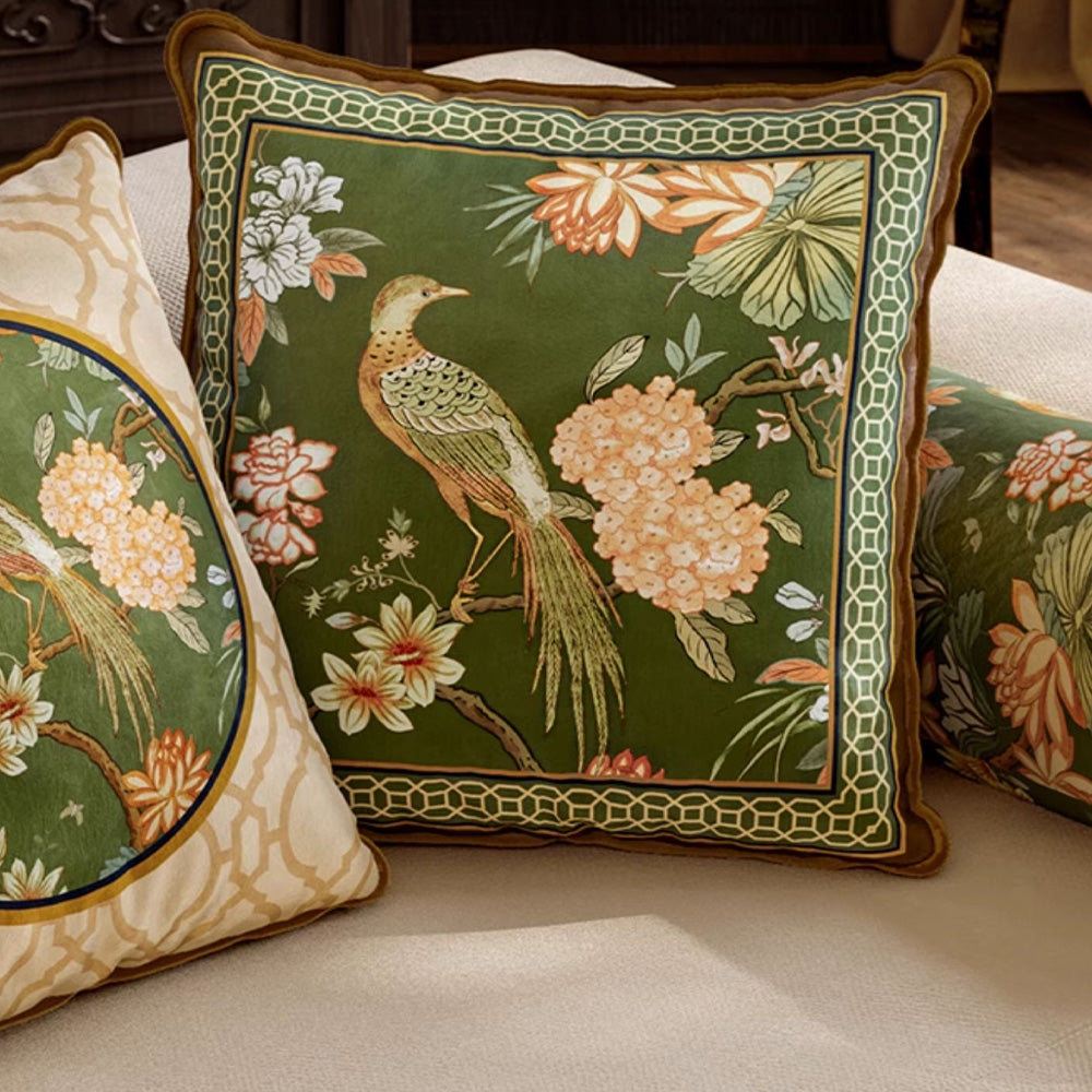 Close room view of Aviary green square bird pillow cover on a sofa