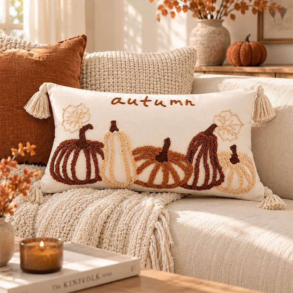 Harvestline embroidered pumpkin lumbar pillow cover styled on a cream sofa with fall accents