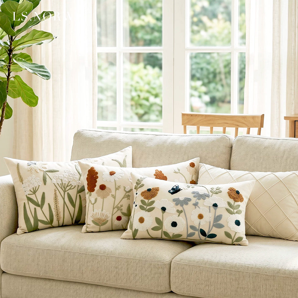 Butterfly and floral embroidered lumbar pillow cover styled on a neutral sofa