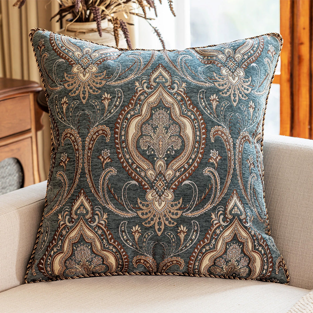 Indigo blue paisley pillow cover displayed on a modern sofa