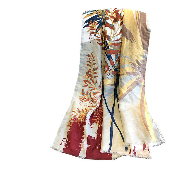 Folded Tropic botanical cotton-linen beach towel with floral leaf print