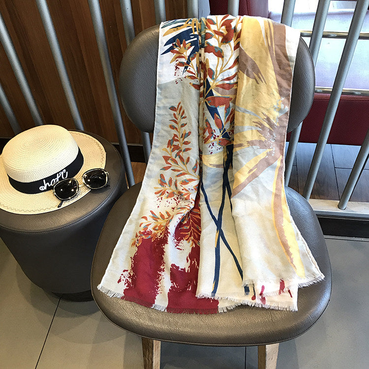 Tropic botanical cotton-linen beach towel draped over a chair