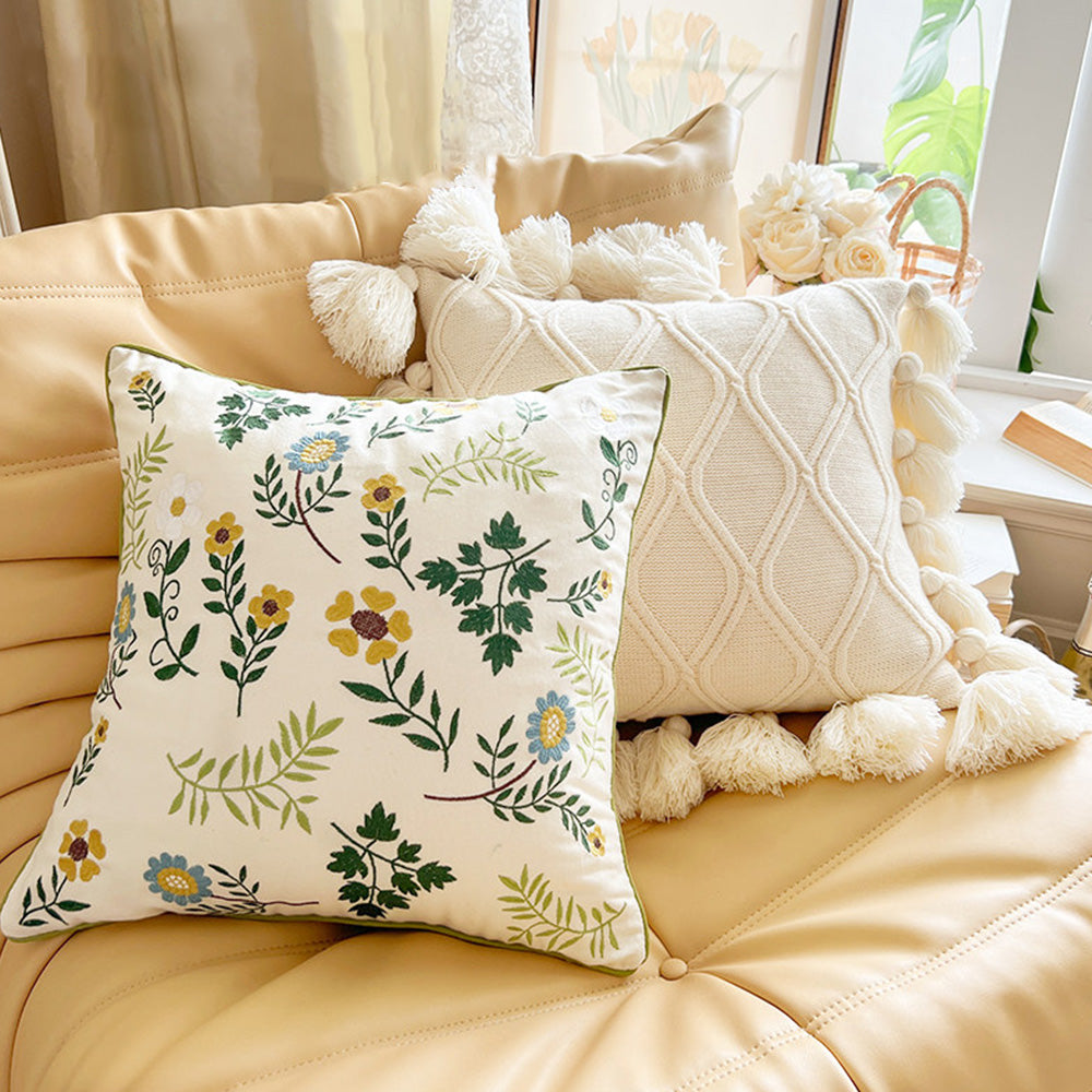 Cottagecore floral decorative pillow cover on beige leather sofa