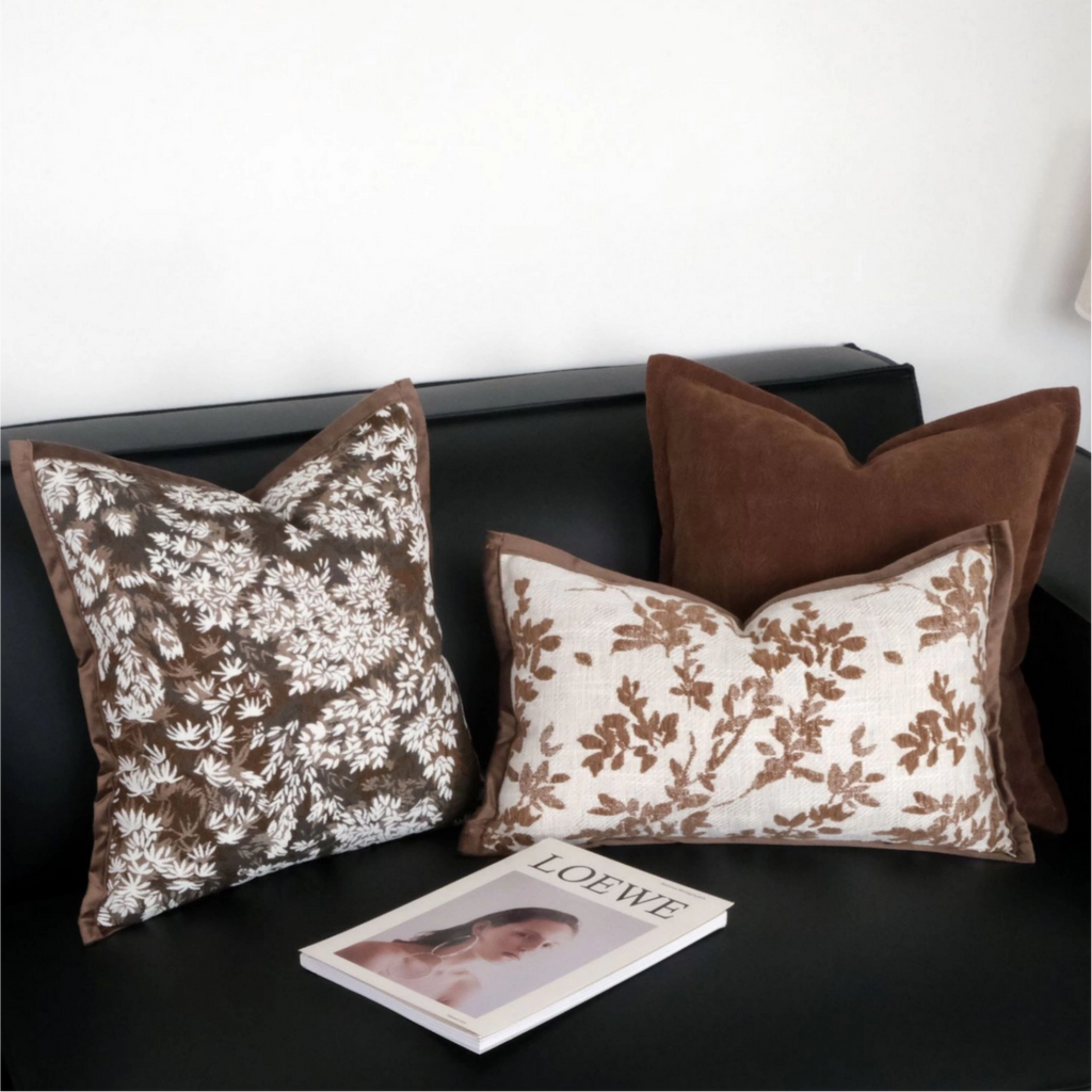brown botanical embroidered throw pillow cover on modern sofa