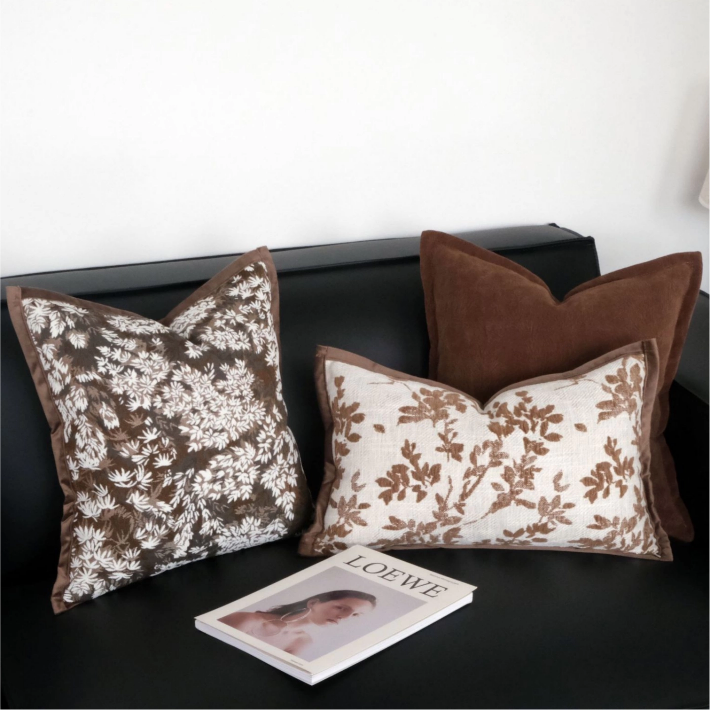 brown botanical embroidered throw pillow cover on modern sofa