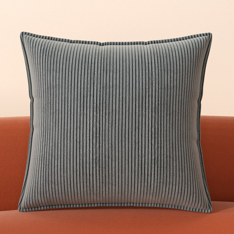 Ridge corduroy pillow cover styled on a sofa in a contemporary living room