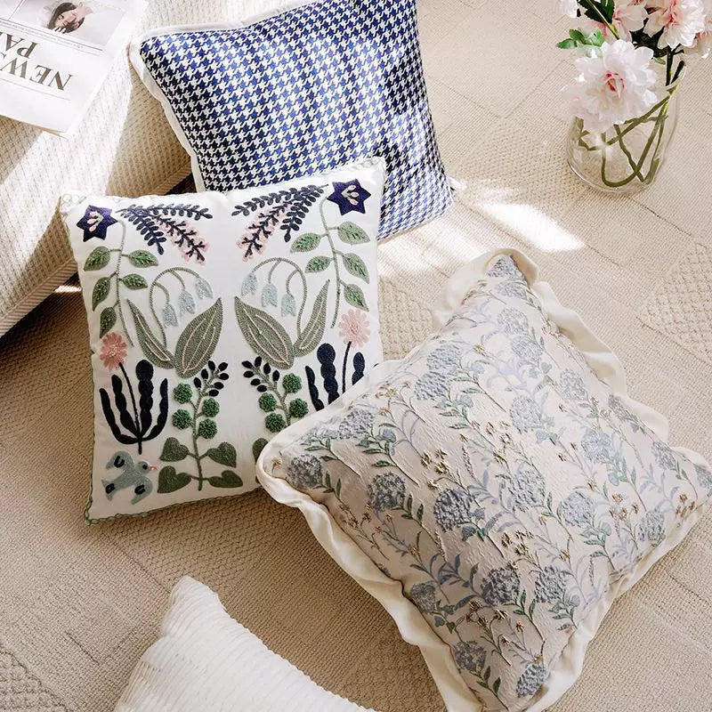 nordic botanical cushion cover with embroidered floral pattern