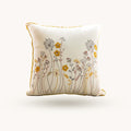 Embroidered floral pillow cover with yellow wildflower botanical design