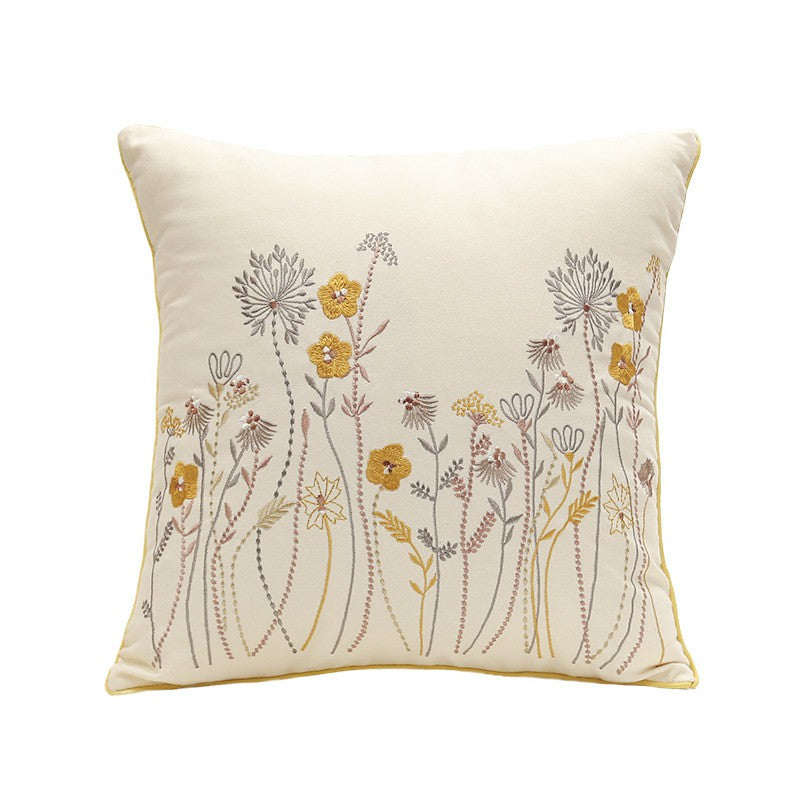 Embroidered floral pillow cover with yellow wildflower botanical design