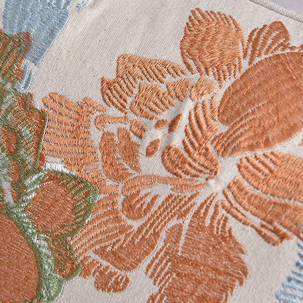 Bouquet embroidered floral pillow cover styled on a neutral sofa