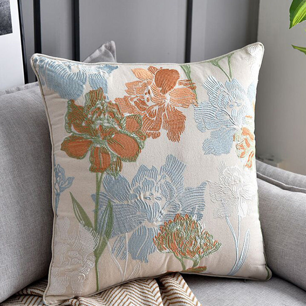 Close-up of blue terracotta and ivory botanical embroidery