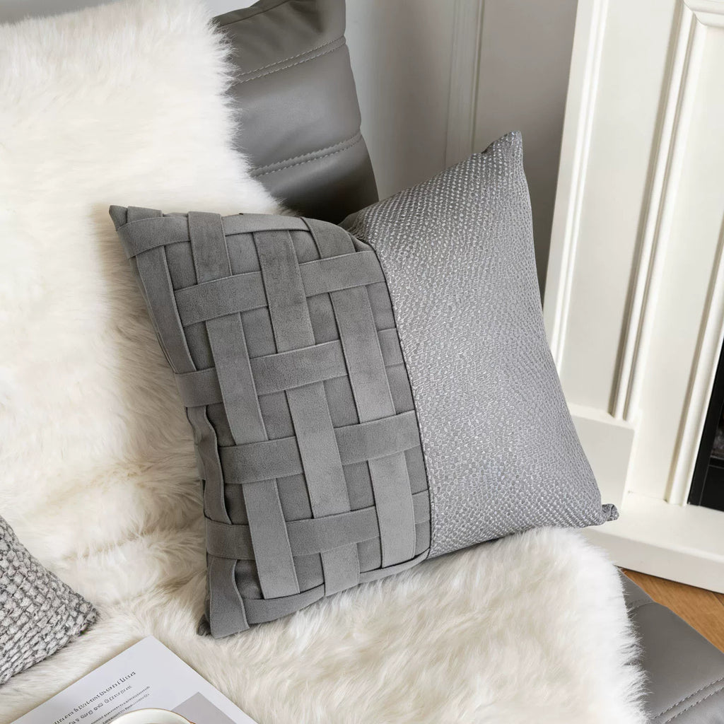 Ash gray woven pillow cover styled on a modern sofa