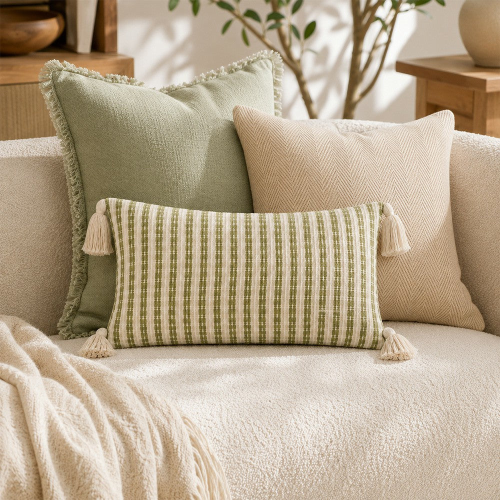 Meadowline rectangular striped pillow cover displayed with sage and herringbone cushions