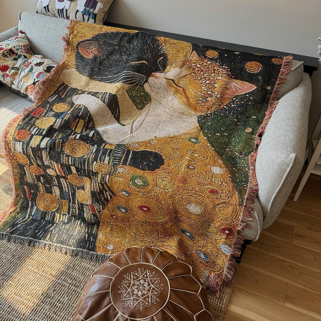 Gilded Cat cotton woven tapestry draped over a living room sofa