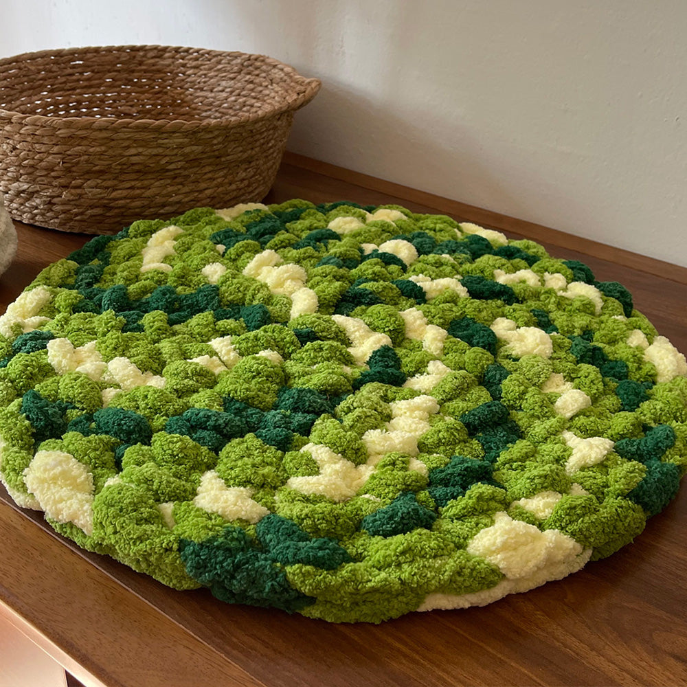 Pebble forest green chenille round seat cushion in a Japandi room