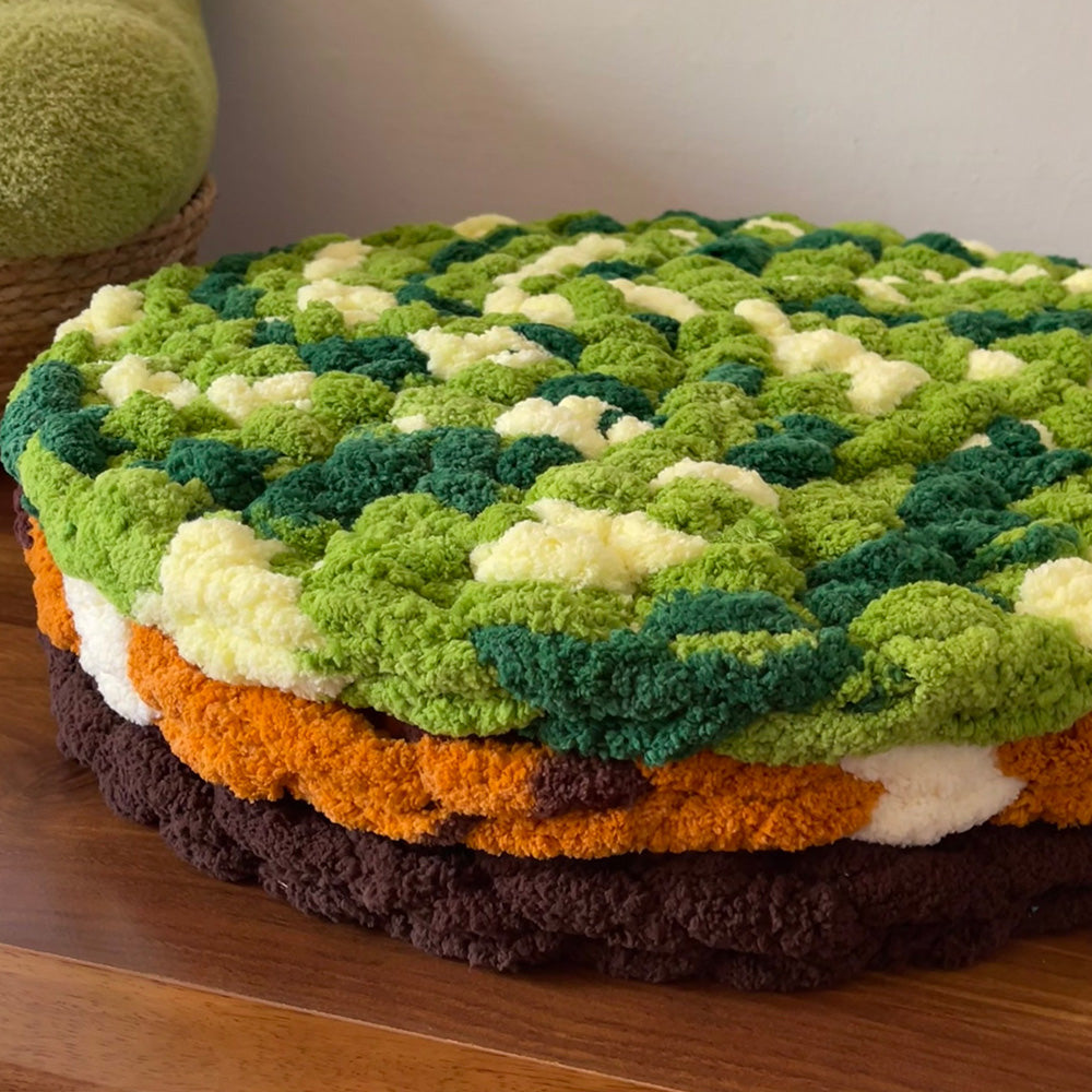 Stacked Pebble chenille round seat cushions with thick tufted texture