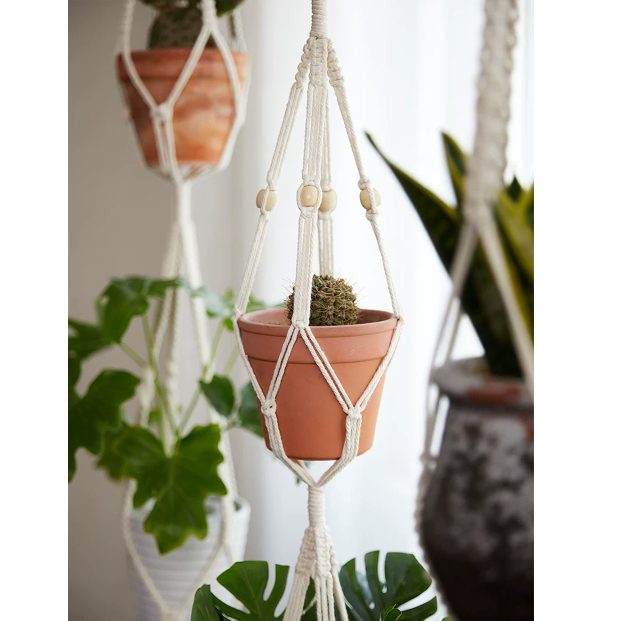 Cascade triple-tier macrame plant hanger with wooden beads