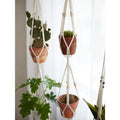 Cotton macrame plant holder supporting 4 to 8 inch pots
