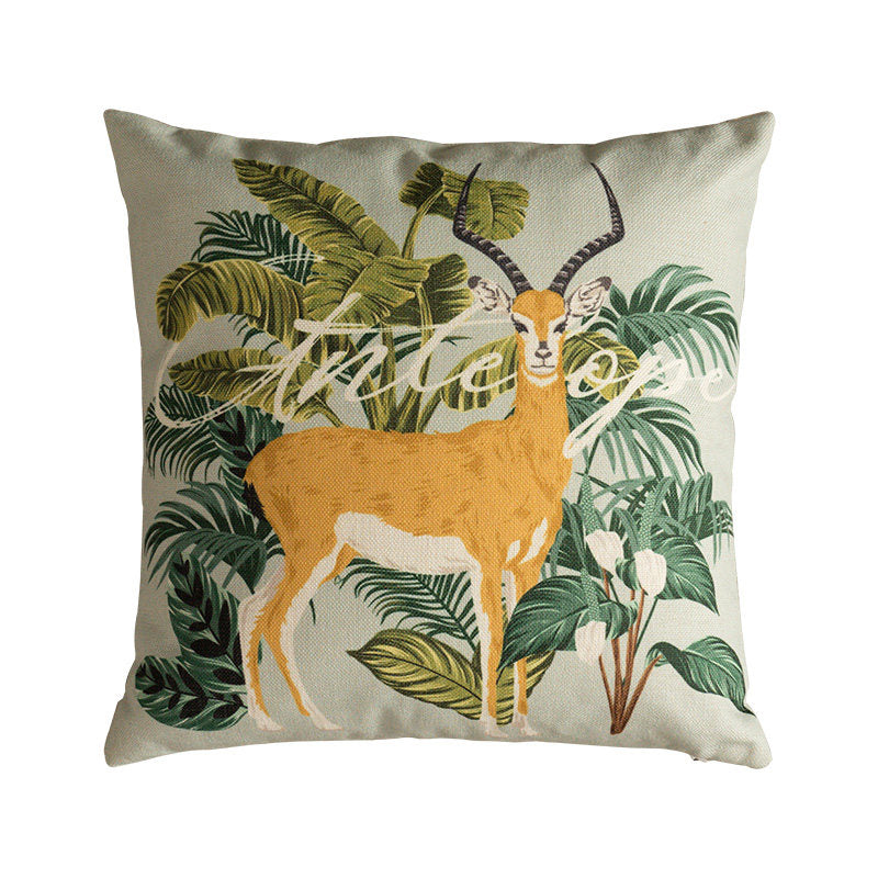 Gazelle botanical decorative pillow cover with tropical green leaves