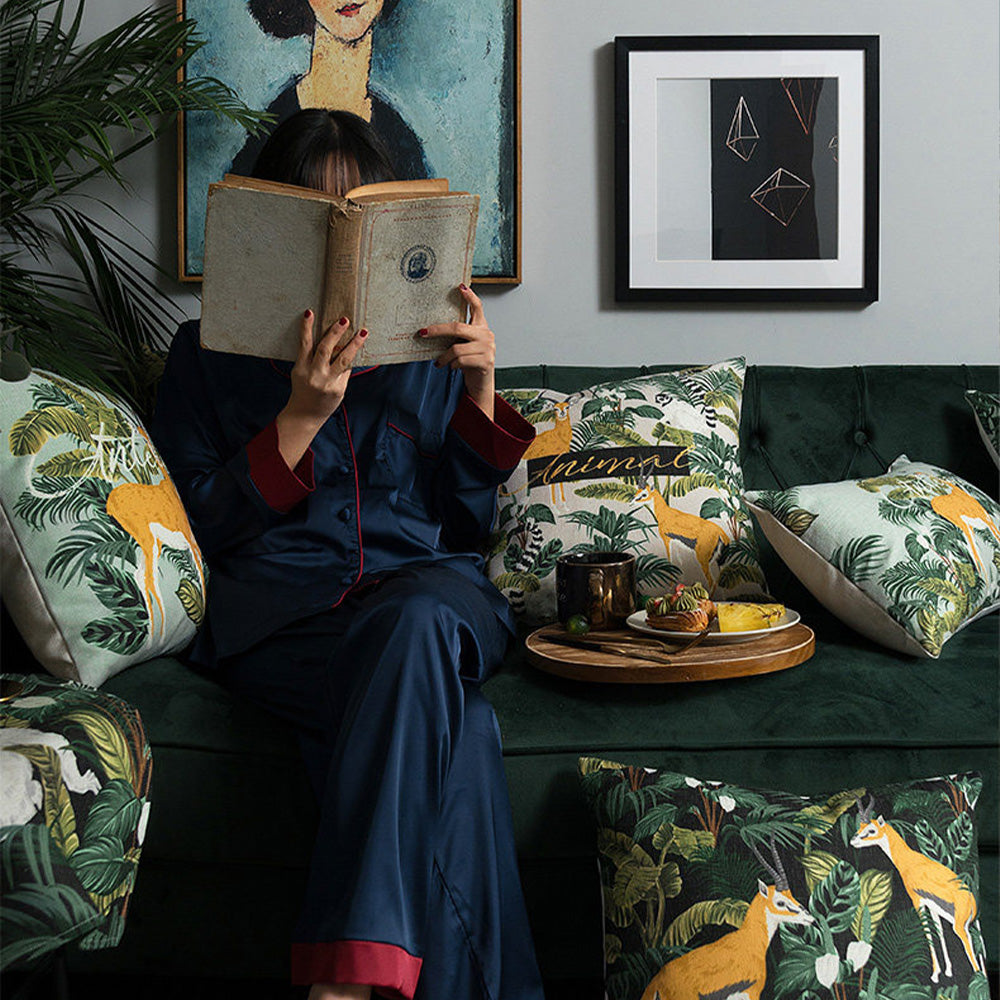 Rainforest safari pillow cover collection styled on a living room sofa