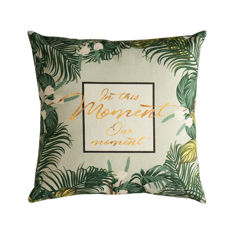 Modern tropical botanical pillow cover featuring minimalist leaf border and typography