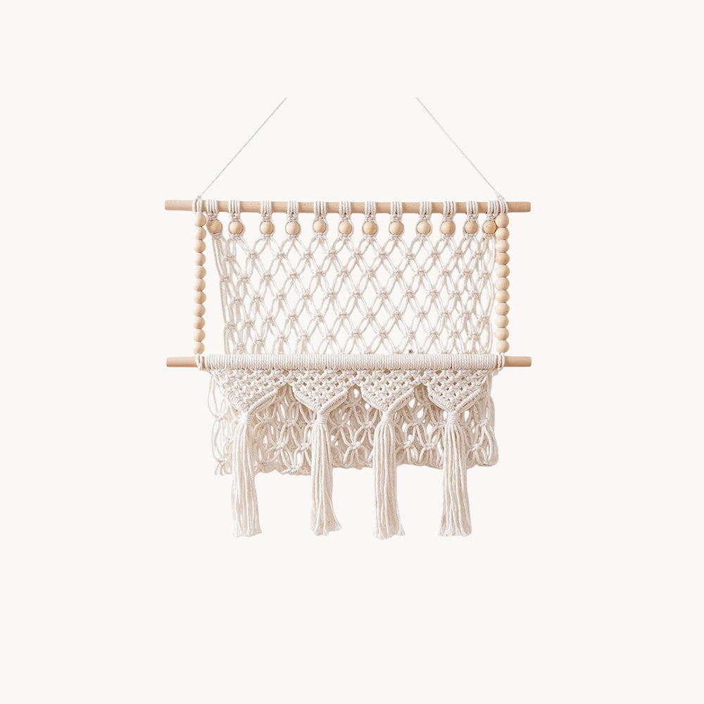 Cream macrame wall organizer with wooden beads dowels and tassel fringe