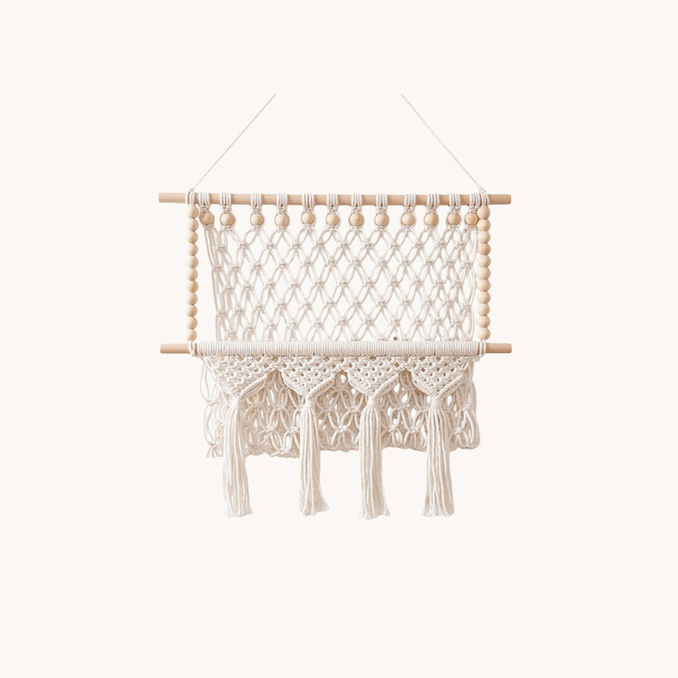 Cream macrame wall organizer with wooden beads dowels and tassel fringe