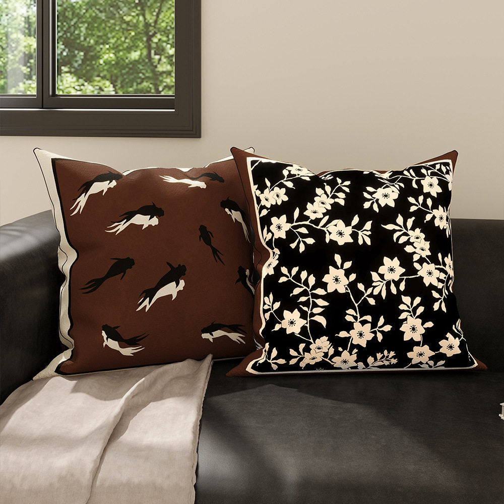 Inkstone black floral and brown goldfish velvet pillow covers in a modern room