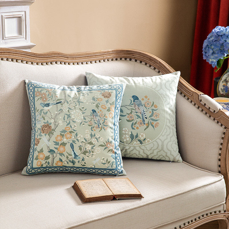 Bluebird botanical pillow cover designs styled on a cream sofa