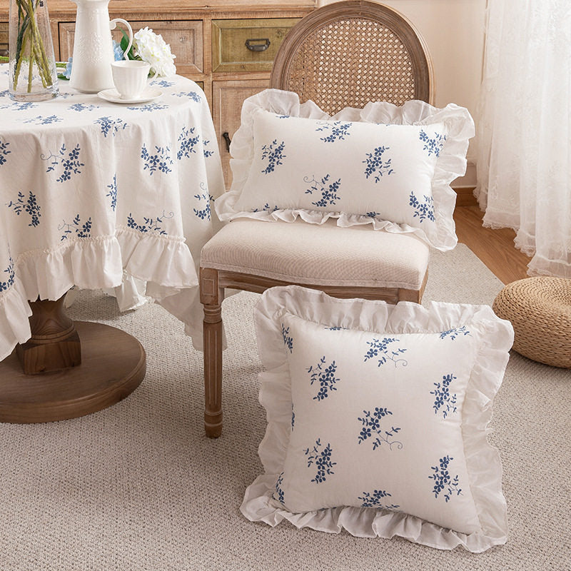 Porcelain blue sprig and floral ruffle pillow covers in a French country room