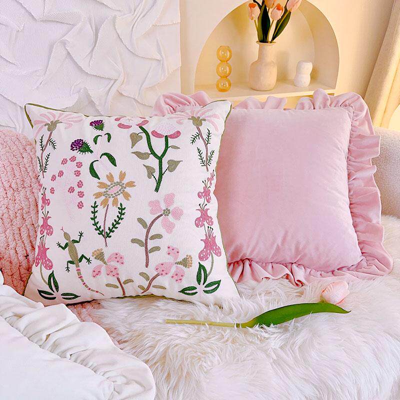 Cottagecore pink floral throw pillow cover on cozy sofa