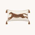 Front view of Prowl brown and cream tufted leopard 12x24 lumbar pillow cover with four tassels