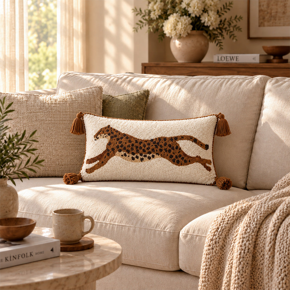 Prowl brown leopard tassel lumbar pillow cover styled on a sunlit cream sofa