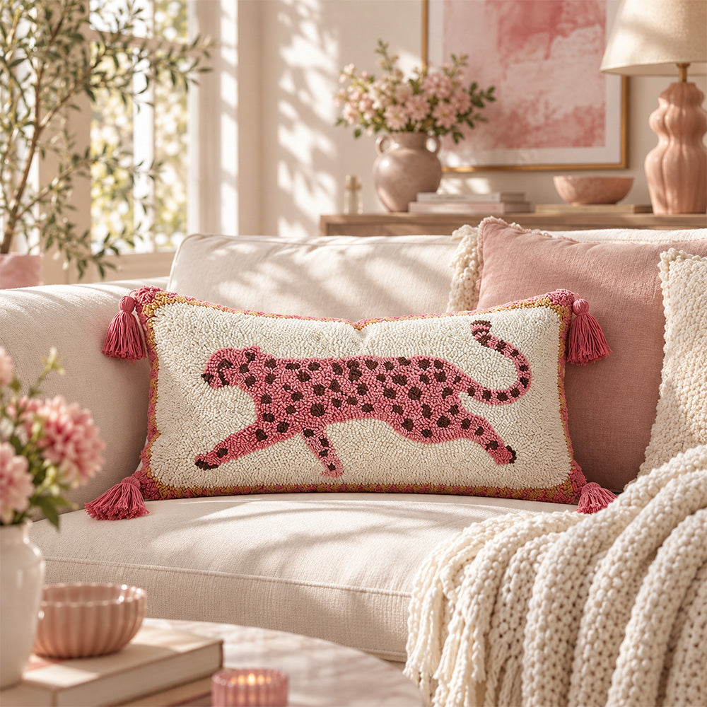 Prowl pink leopard lumbar pillow cover layered with blush cushions in a bright living room