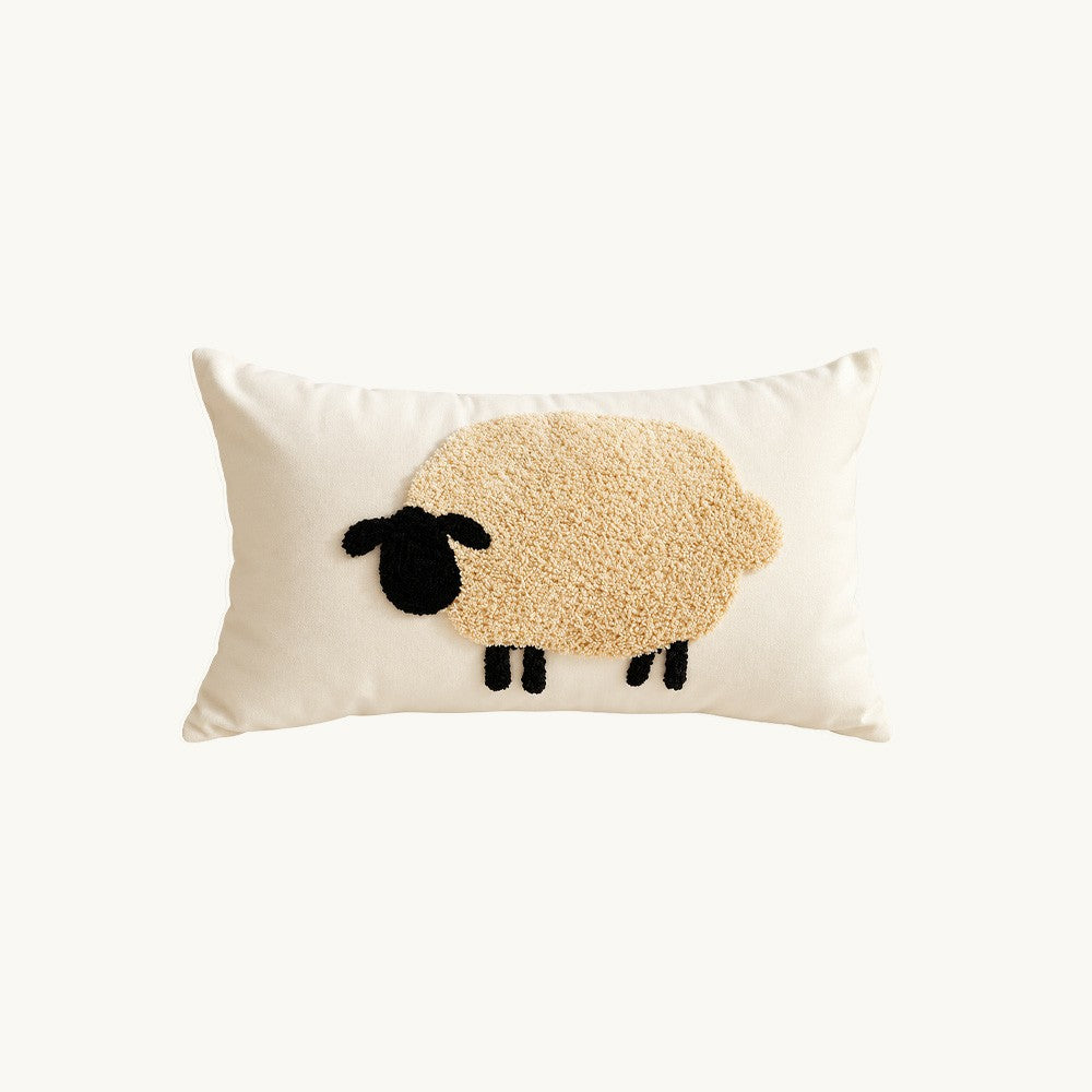 Pasture cream 12x20 lumbar pillow cover with three beige and black tufted sheep