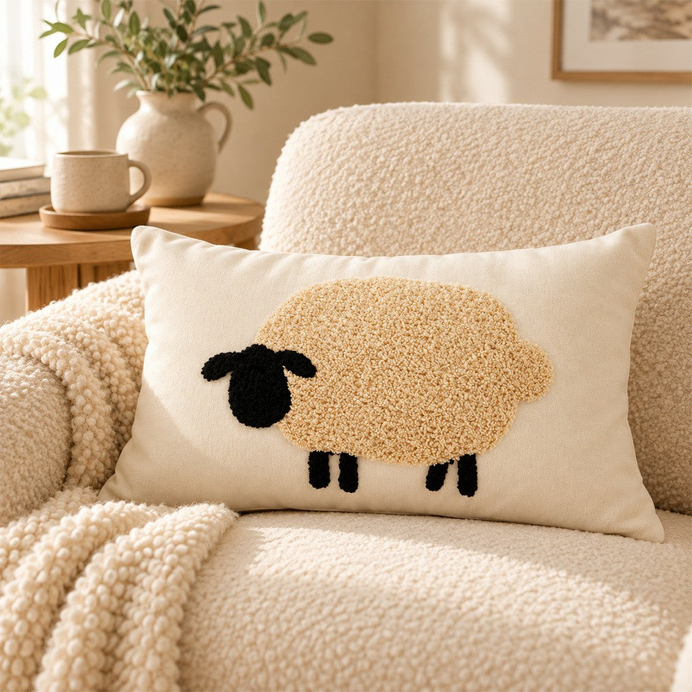 Cozy armchair scene with the sheep lumbar pillow in warm neutral tones.