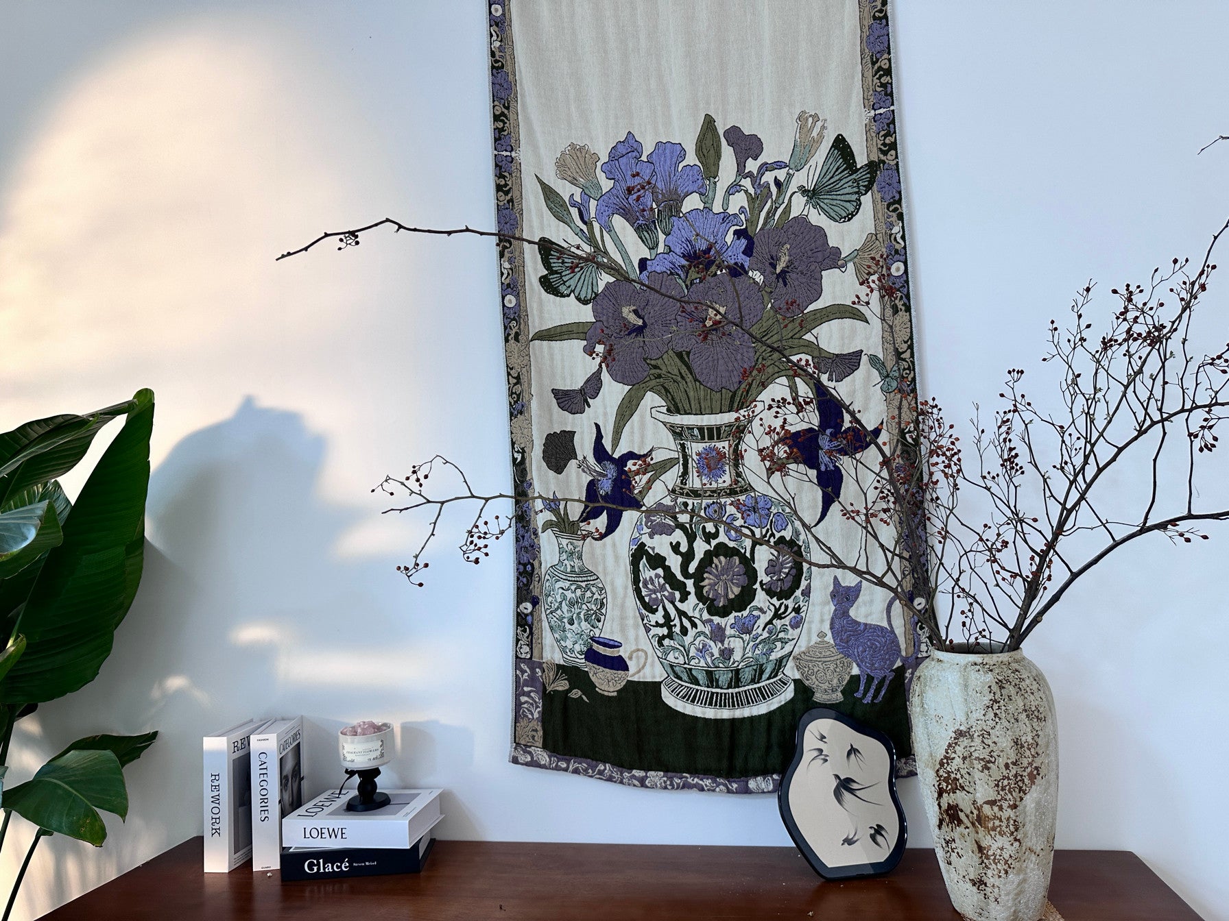 Floribunda botanical cotton throw blanket used as wall art above a console