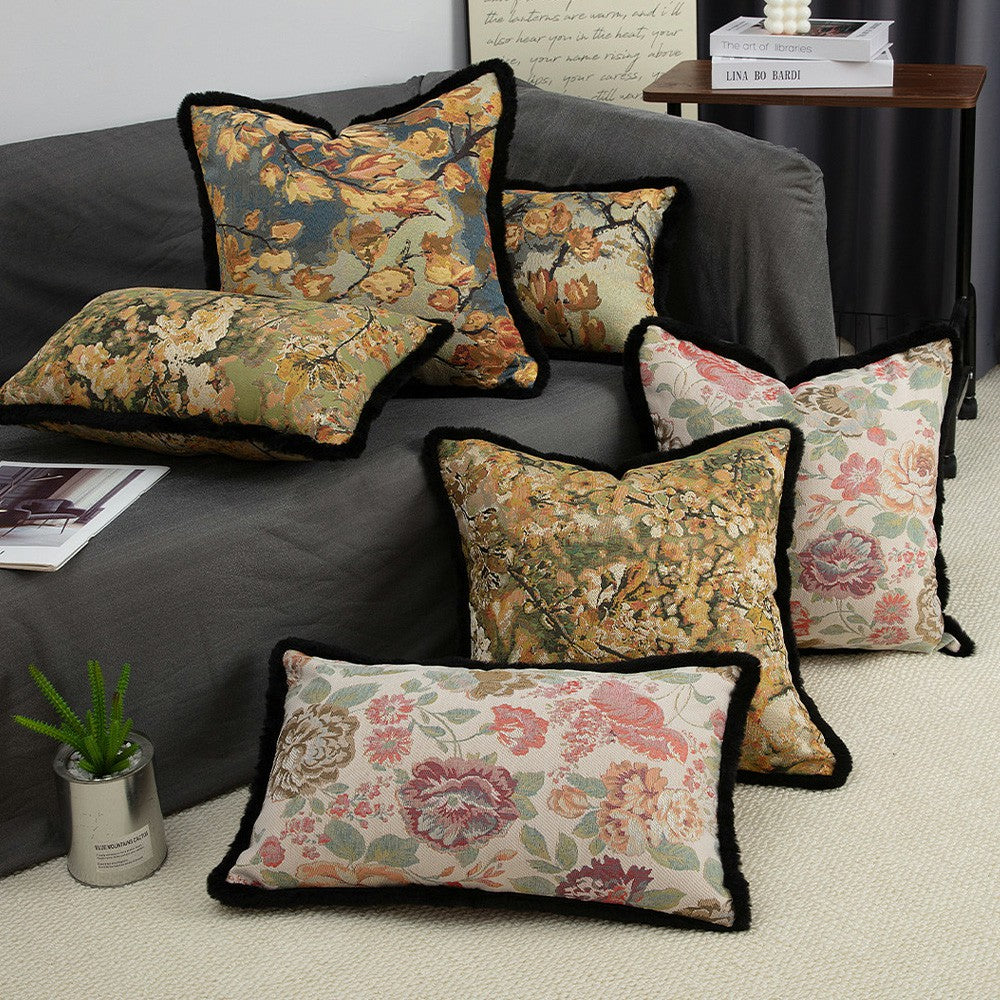 Chateau floral tapestry pillow cover collection layered on a modern sofa