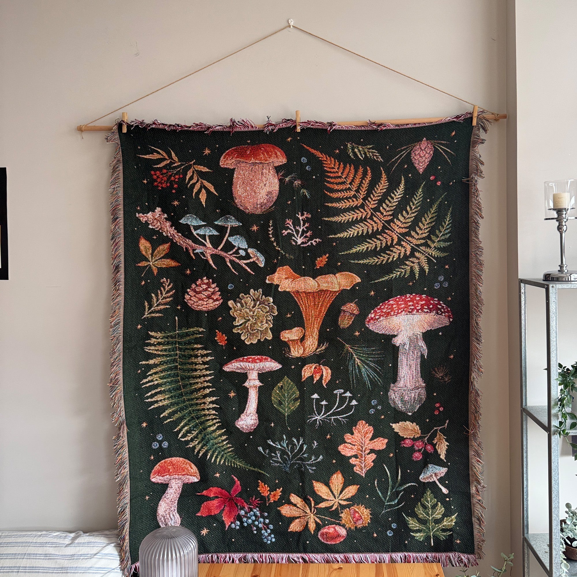 Mushroom Grove dark woodland mushroom tapestry displayed above a bed