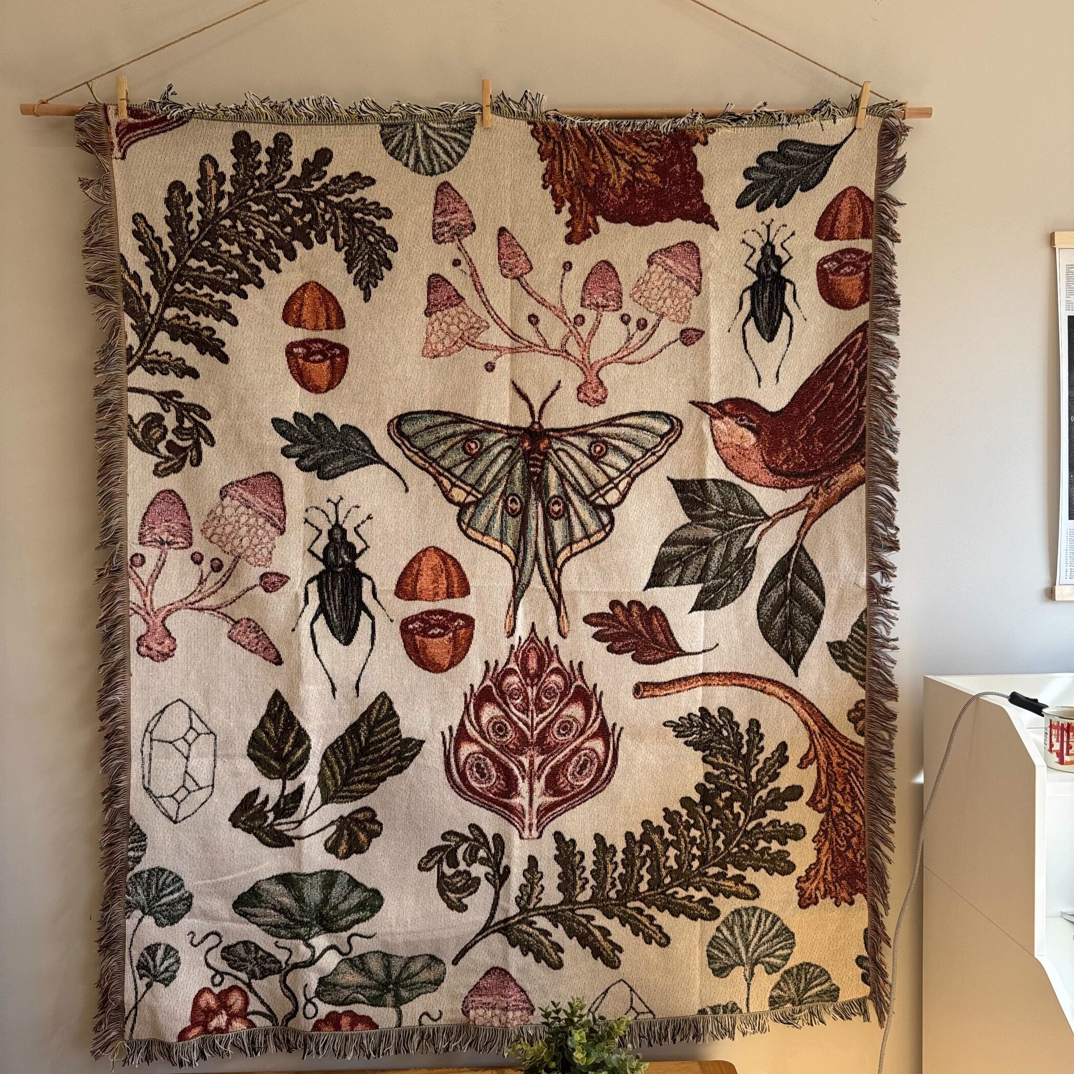 Full view of cream Mushroom Grove botanical tapestry with moth beetles ferns and acorns