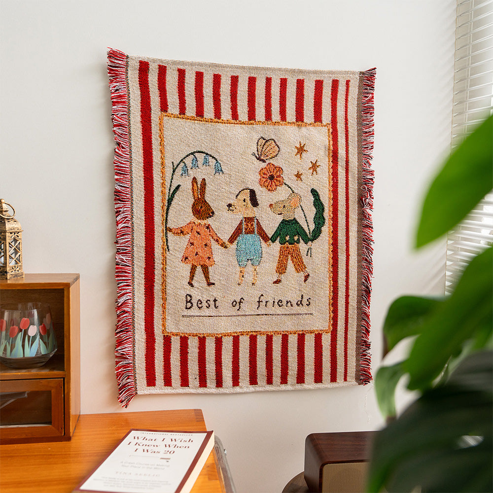 Fablefolk Style A animal friends woven tapestry displayed on a small interior wall