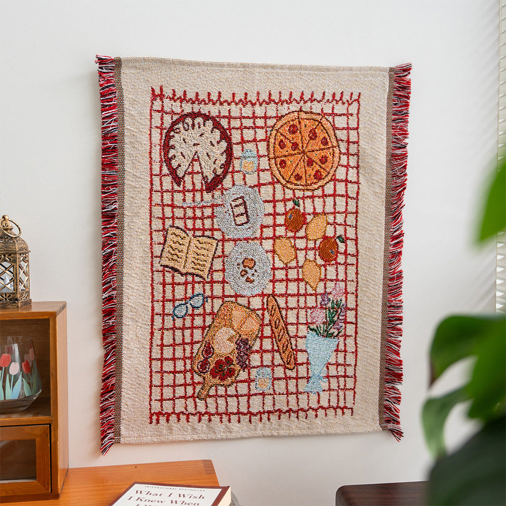 Fablefolk Style B woven wall tapestry with picnic table artwork, red checks and side fringe