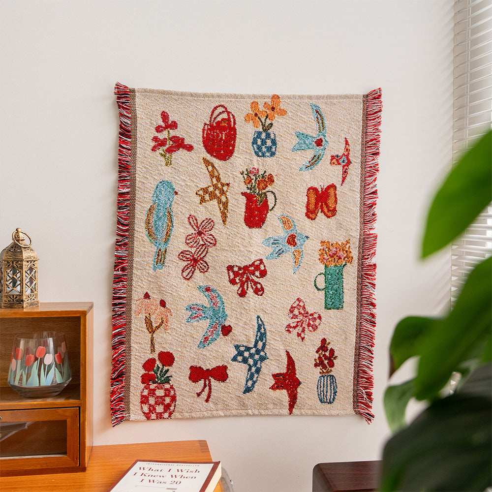 Fablefolk Style D woven wall hanging with colorful birds, bows, flowers and decorative vessels