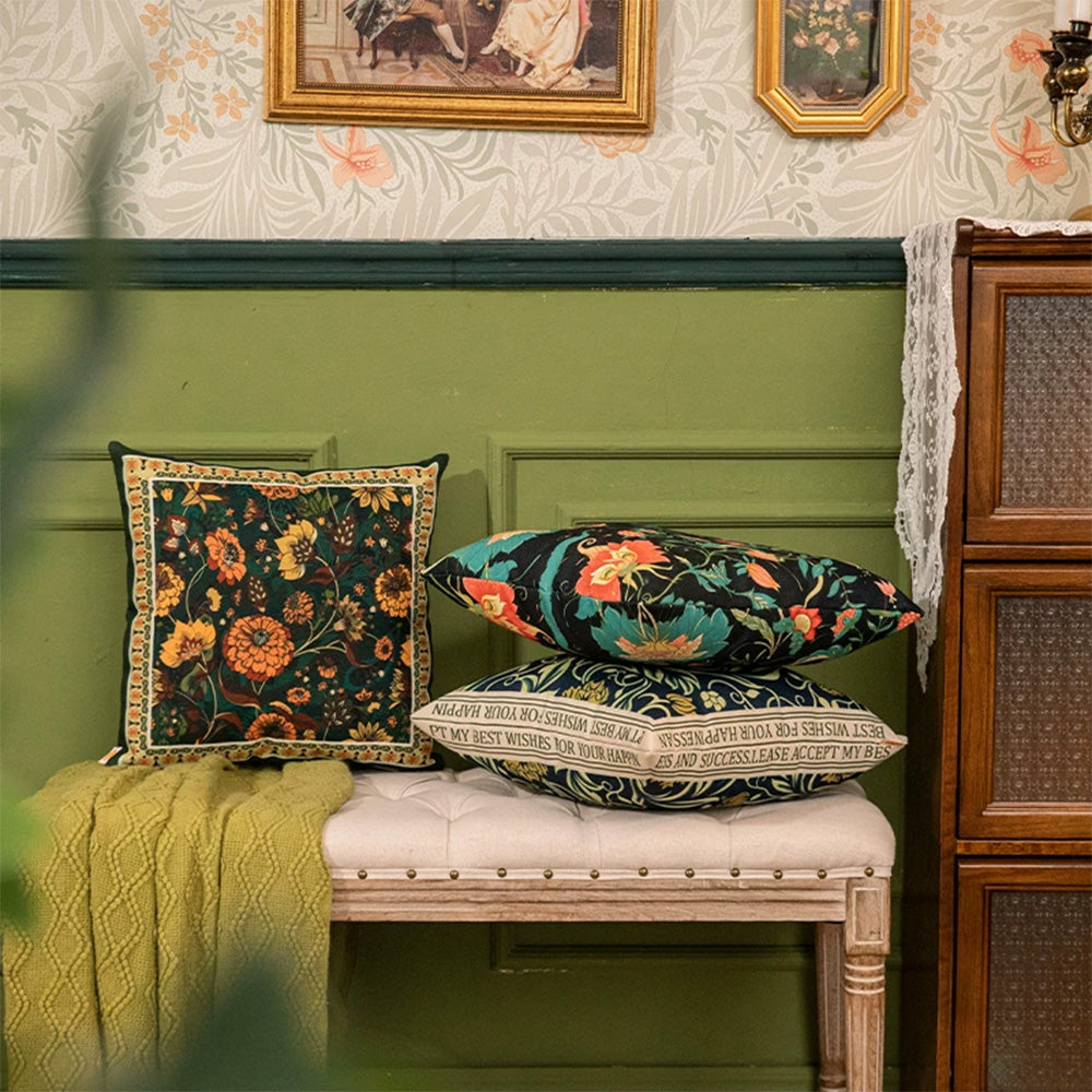 Jacobean botanical pillow covers styled on a classic wooden bench
