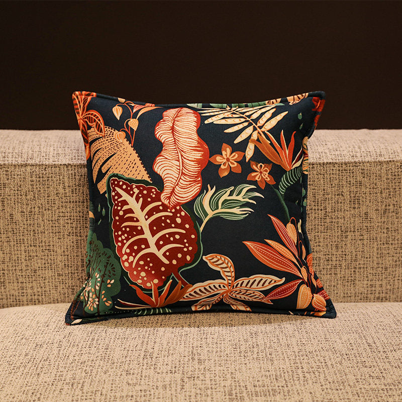 Verdure dark tropical chenille pillow cover styled on a modern sofa