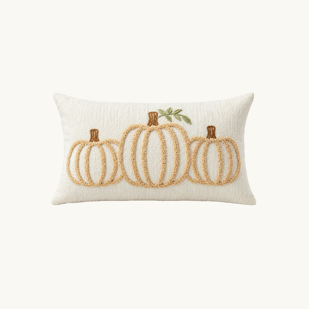 Front view of Ivorymere ivory chenille 12x20 lumbar pillow cover with three raised neutral pumpkins